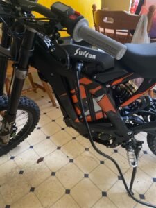 Comprehensive Guide to Surron Chargers: Light Bee, Storm Bee, and Ultra Bee 4 Charging a plugged in surron light bee